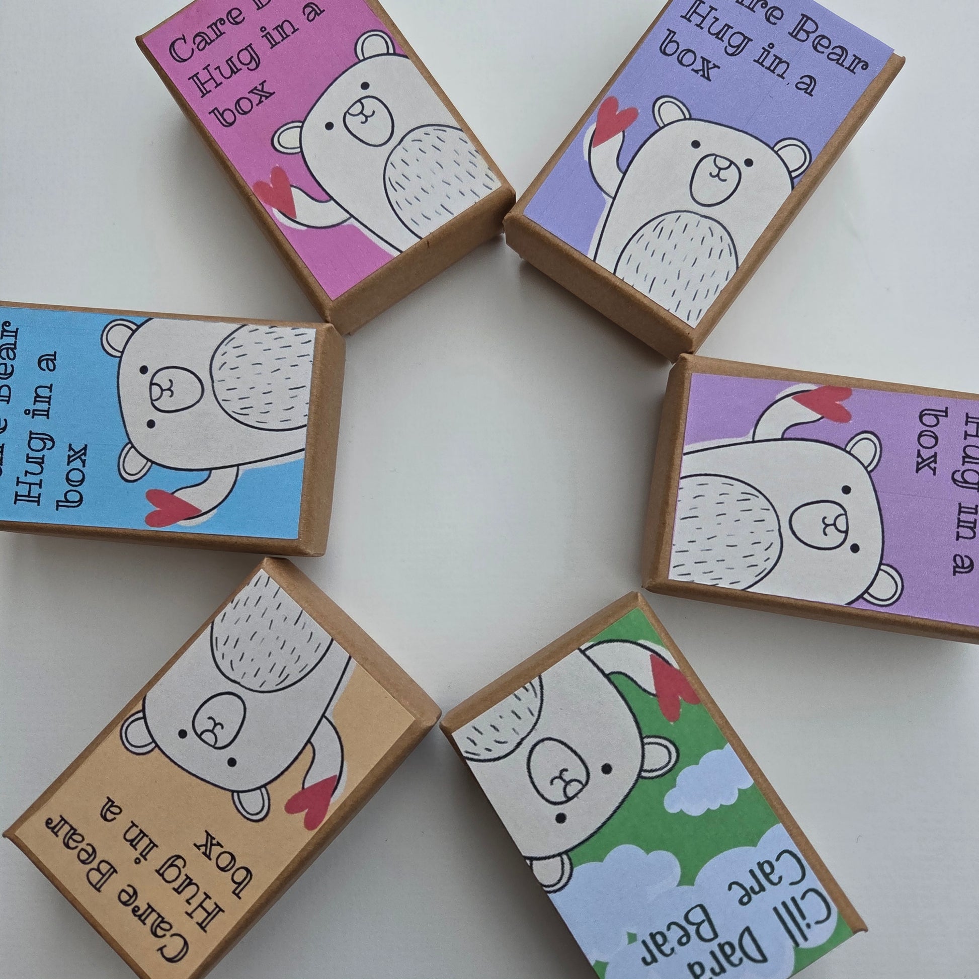 Set of small boxes with bear illustrations and text on a white background